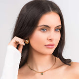 Model wearing ARIIRA Emerald Green Gemstone Necklace in gold, showcasing elegance and modern minimalism.