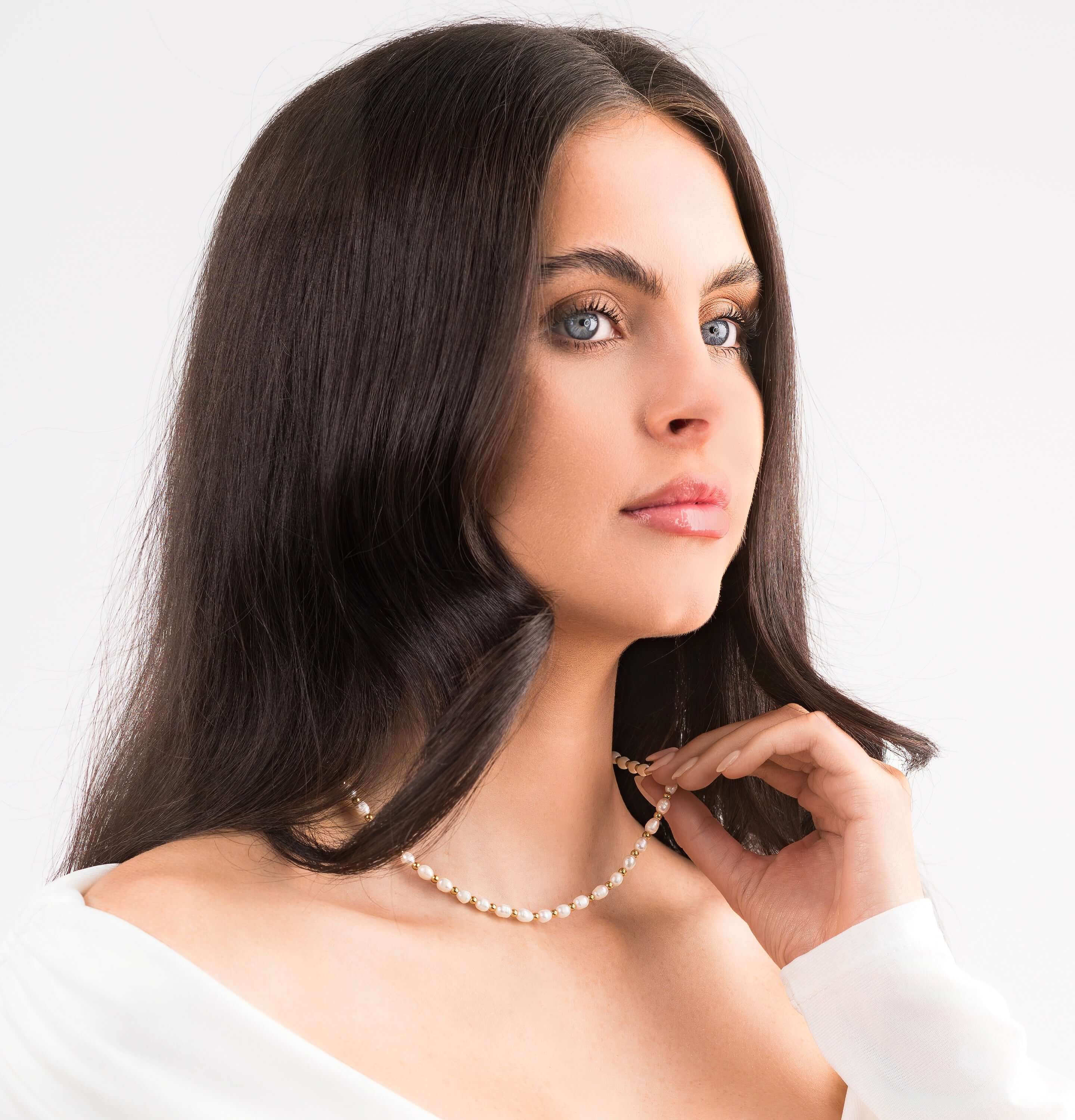 Model wearing ARIIRA Elena Freshwater Pearl Bead Necklace, showcasing natural elegance and modern charm.