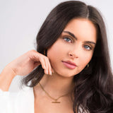 Mila Gold Bar Pendant Necklace worn by a woman, showcasing a sleek gold bar charm and chic look for versatile styling.