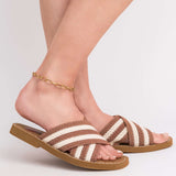 Lina Elongated Link Chain Gold Anklet paired with stylish striped sandals, adding a touch of luxury to summer outfits.