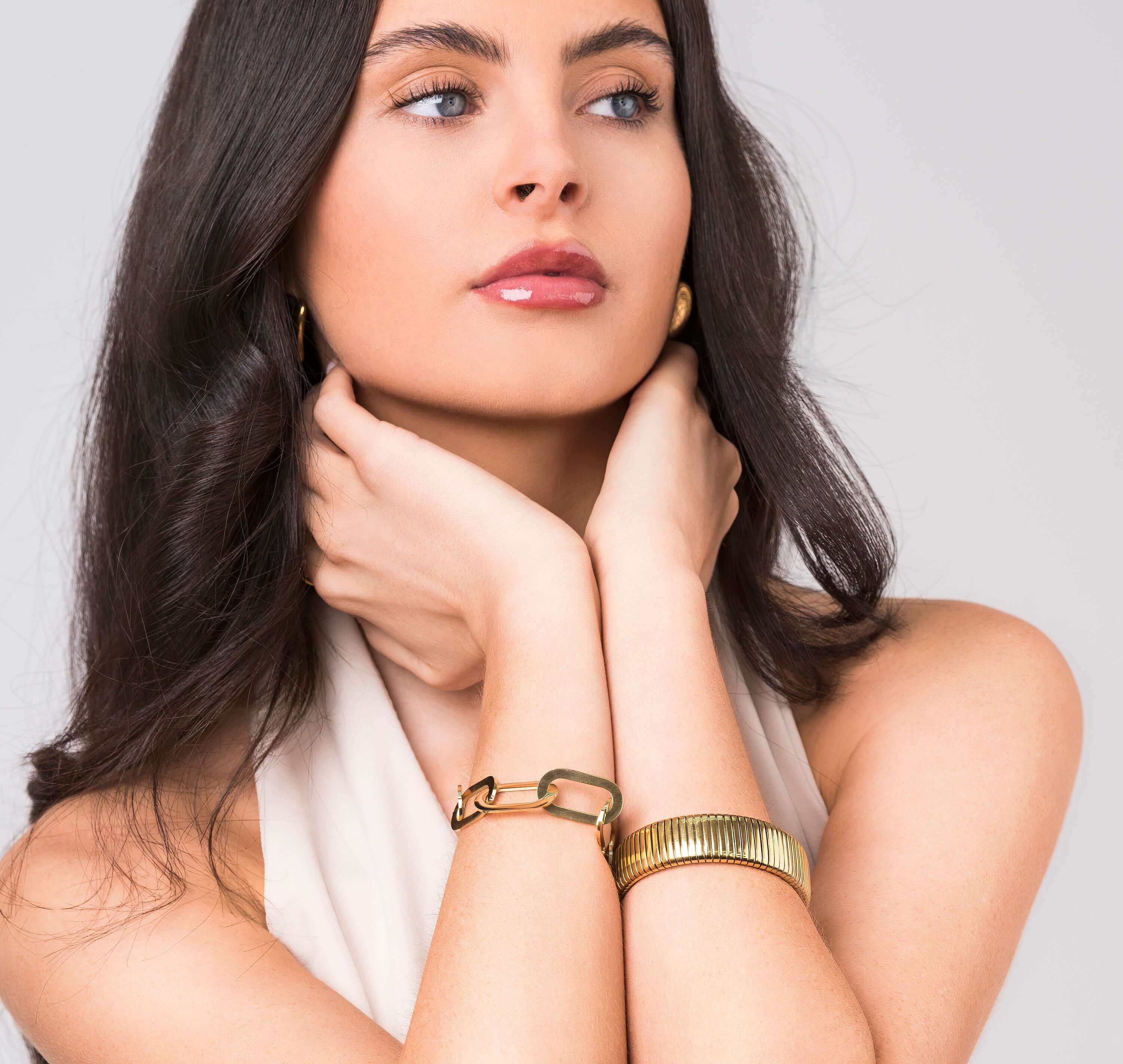 Model showcasing Jenna Geometric Chunky Link Chain Bracelet, emphasizing bold design and elegance.