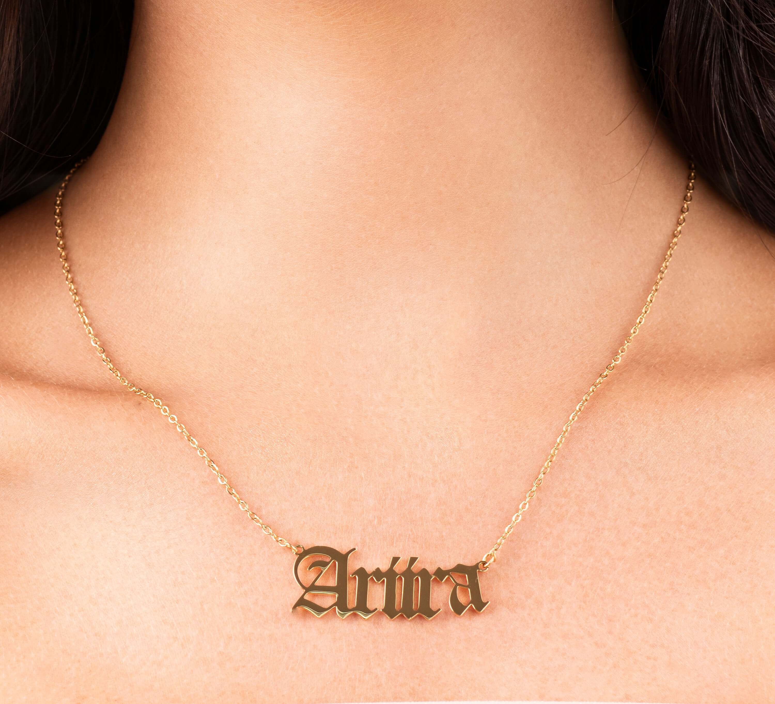 Ayla Custom Name Necklace in gold with the name 'Ariira' elegantly displayed.