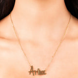 Personalised gold name necklace with the name 'Ariira' in soft script, perfect for everyday layering.