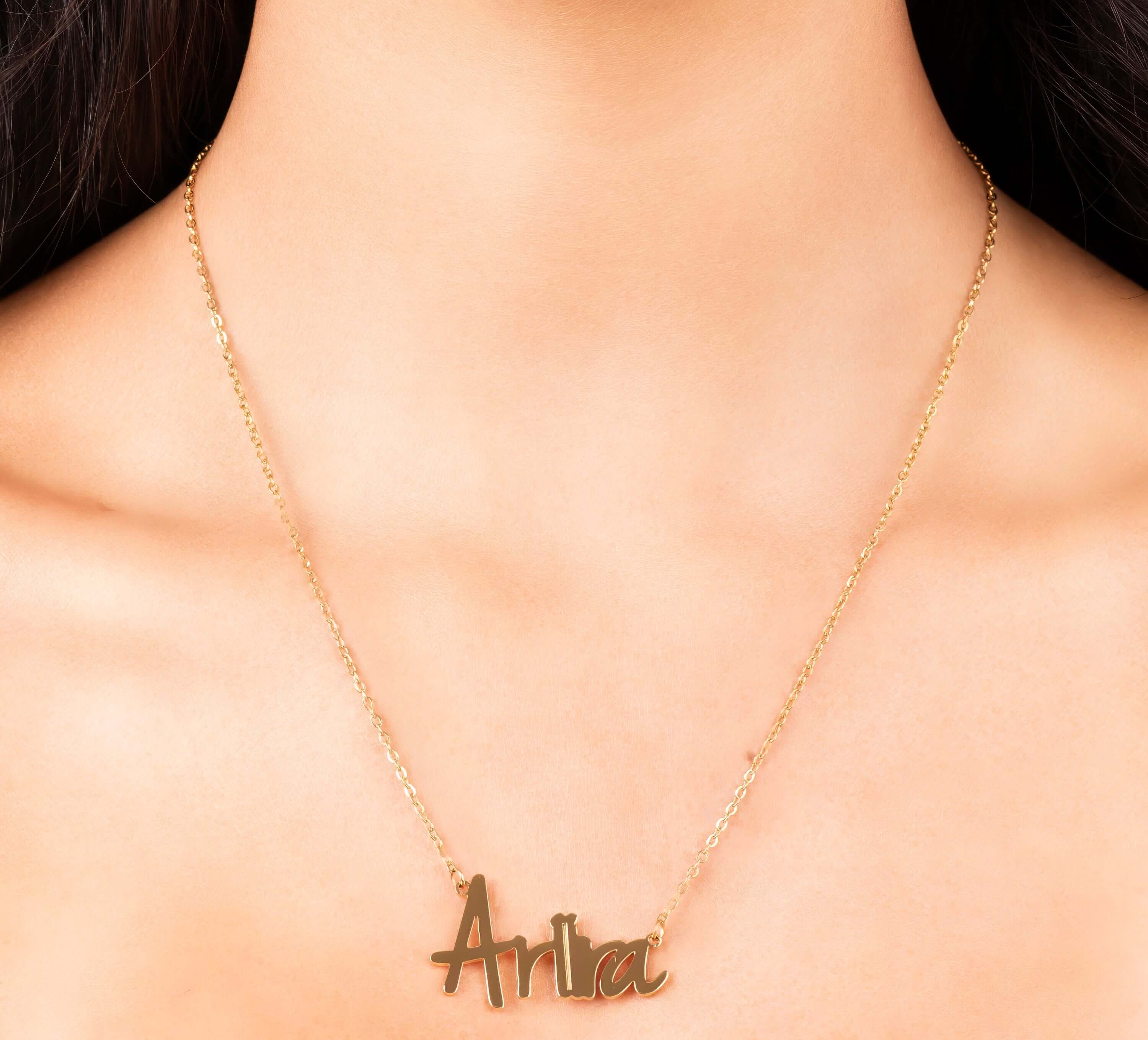 Personalised gold name necklace with the name 'Ariira' in soft script, perfect for everyday layering.