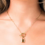 Gold Camila Toggle Chain Necklace with Padlock Pendant by ARIIRA, showcasing contemporary and edgy style.
