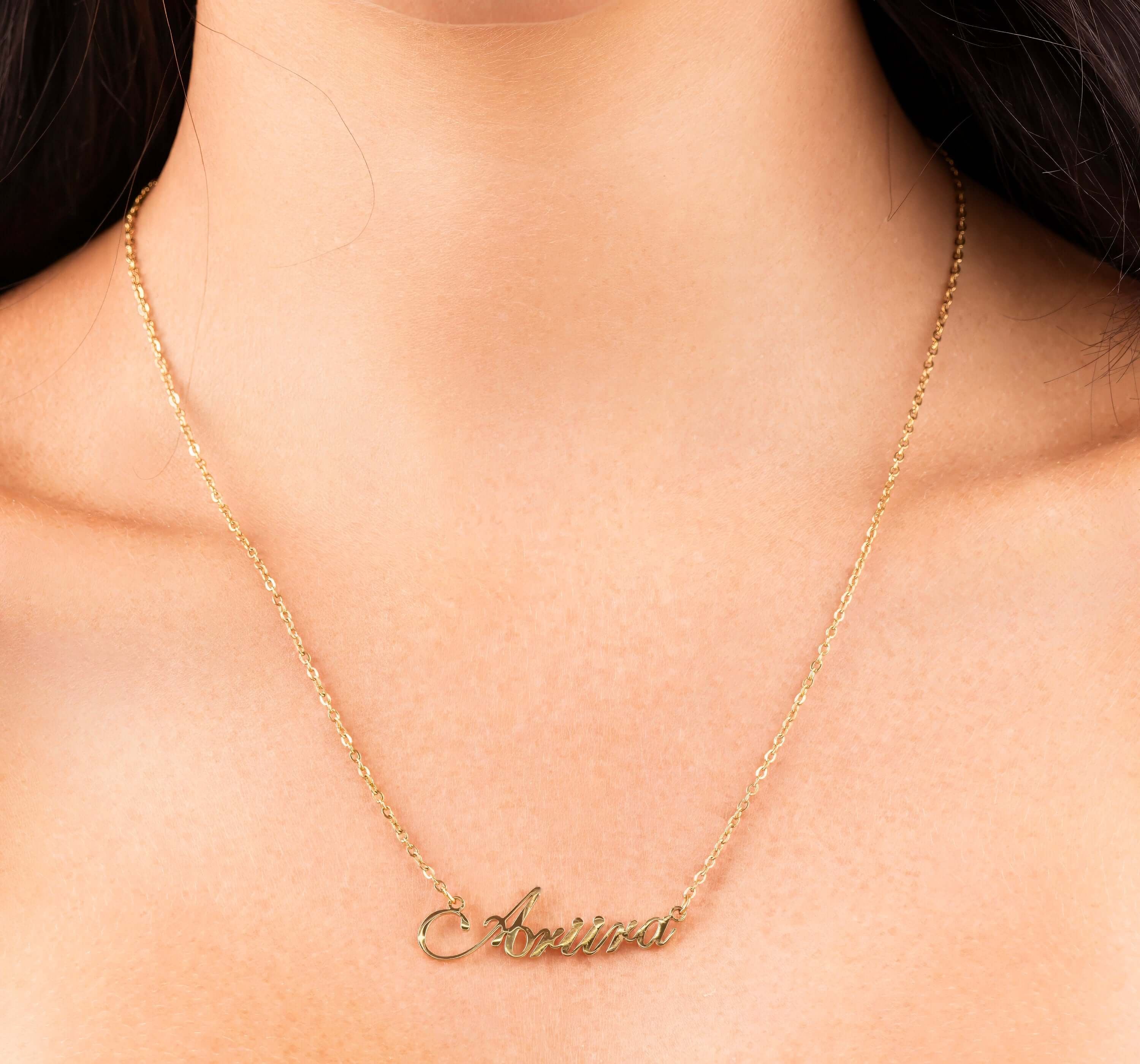 Personalised gold name necklace with 'Ariira' elegantly designed for a refined everyday look.