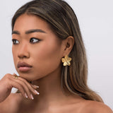 Model wearing ARIIRA Isla Blooming Petal Earrings, showcasing intricate design and modern elegance.