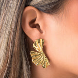 Gold Lyra Sculpted Petal Earrings showcasing organic elegance and light-reflecting curves.