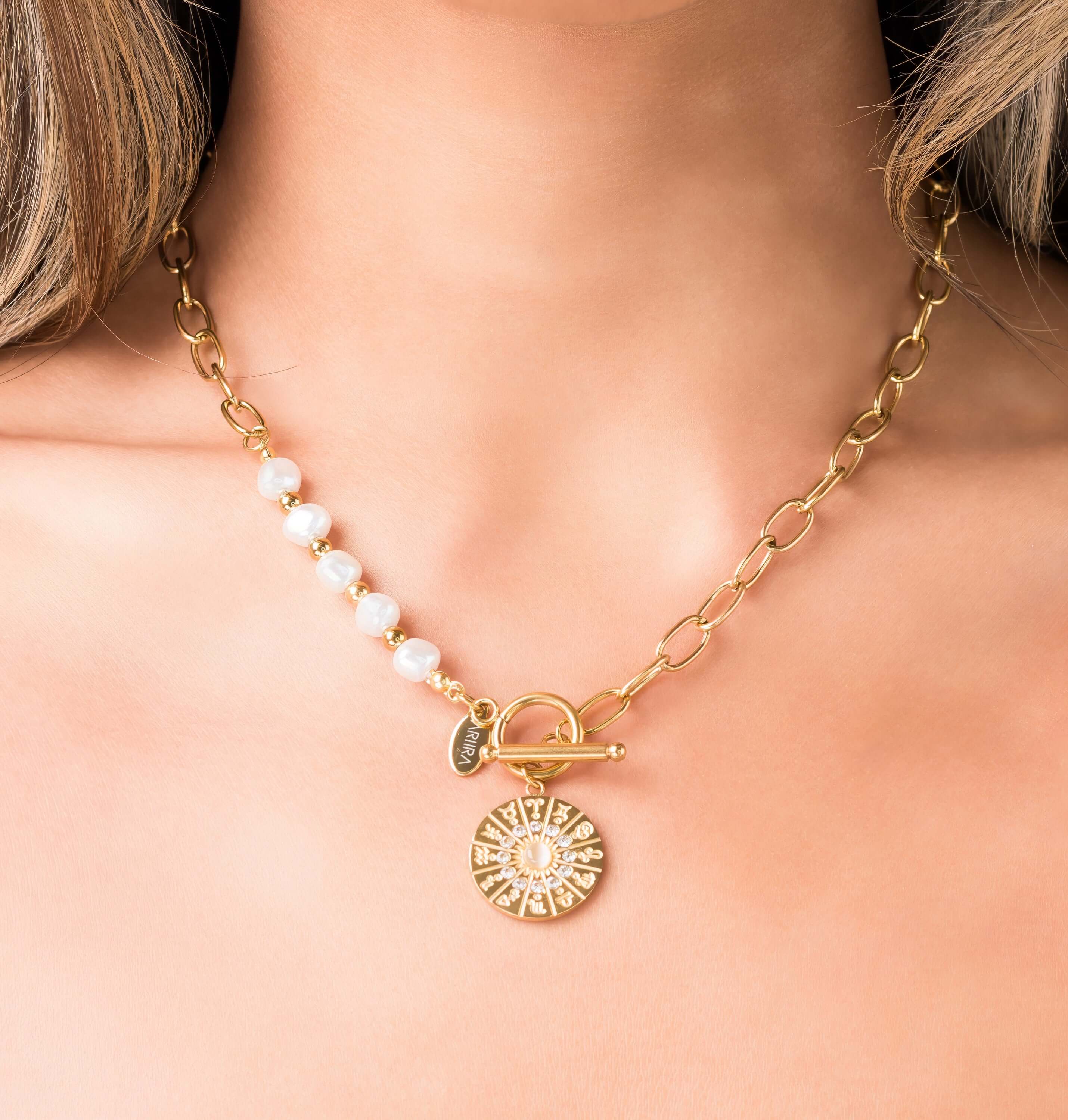 Mira Pearl Link Medallion Necklace by ARIIRA with freshwater pearls and gold chain links, featuring a detailed medallion charm.