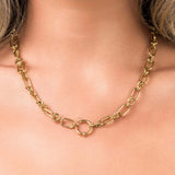 Elina Chunky Link Toggle Chain Necklace by ARIIRA, featuring bold gold links and a circular toggle clasp.
