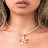 Gold twisted rope necklace with starfish charm pendant, symbolizing ocean magic and renewal. Perfect for summer layering.
