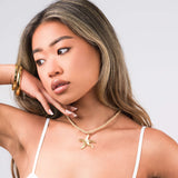 ARIIRA Lyra Twisted Rope Necklace with Starfish Charm, showcasing ocean-inspired elegance and summer vibes.