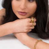 Woman wearing Mira Organic Texture Bold Ring by ARIIRA, showcasing its unique high-shine finish and sculptural design.