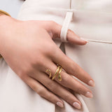 Amaya Textured Serpent Wrap Ring by ARIIRA shown on a hand, featuring an embossed scale texture and adjustable fit.
