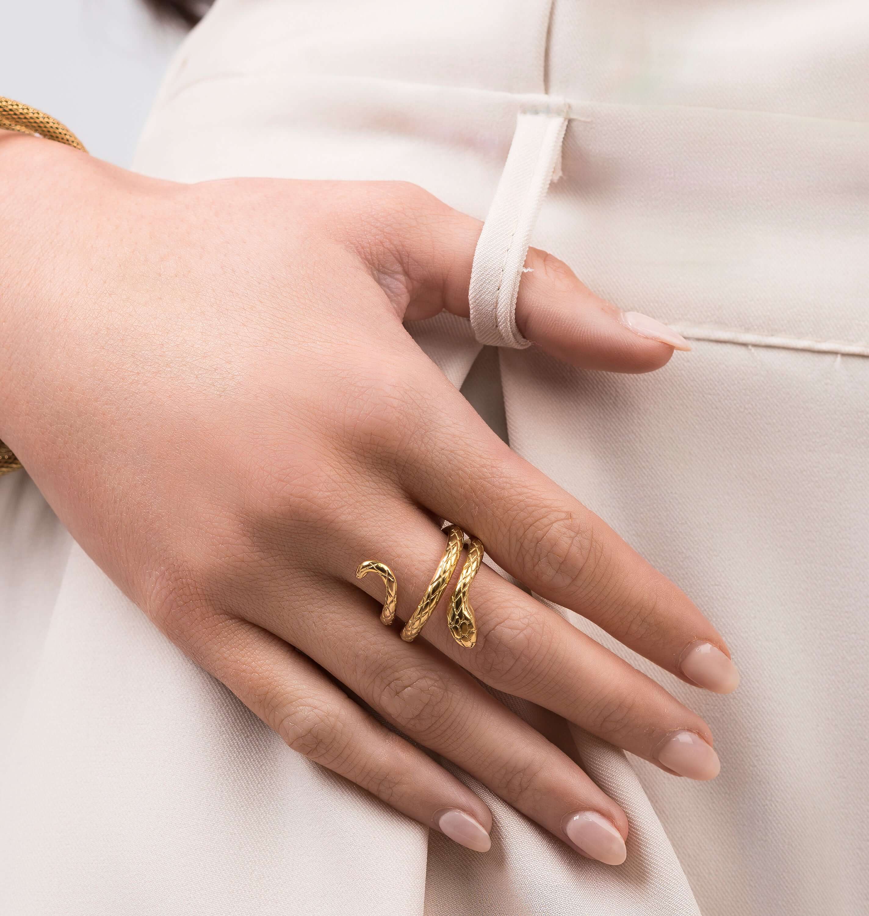 Amaya Textured Serpent Wrap Ring by ARIIRA shown on a hand, featuring an embossed scale texture and adjustable fit.