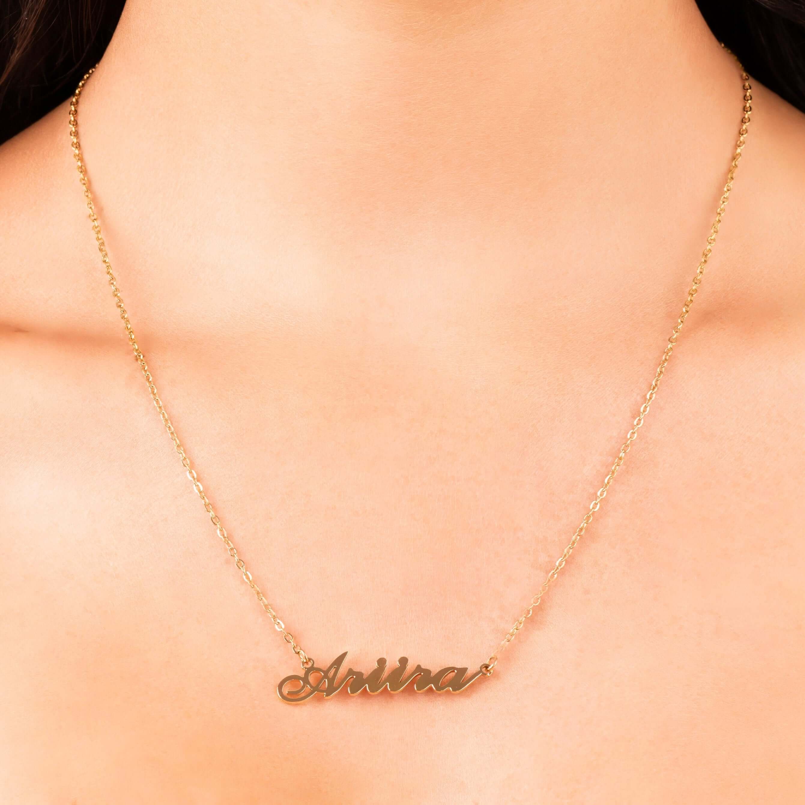 Personalized gold name necklace with the name 'Ariira' in elegant script, a beautiful layering piece for women.