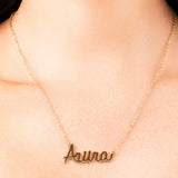 Zayna Custom Name Necklace featuring the name 'Aura' in elegant script font on a fine gold chain.