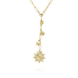 Gold Celestial Charm Drop Necklace by ARIIRA featuring sun, star, heart, and medallion charms on a chain.