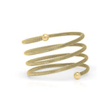 Elegant ARIIRA Zina Spiral Mesh Coil Bracelet in gold, showcasing a textured design with polished end spheres.