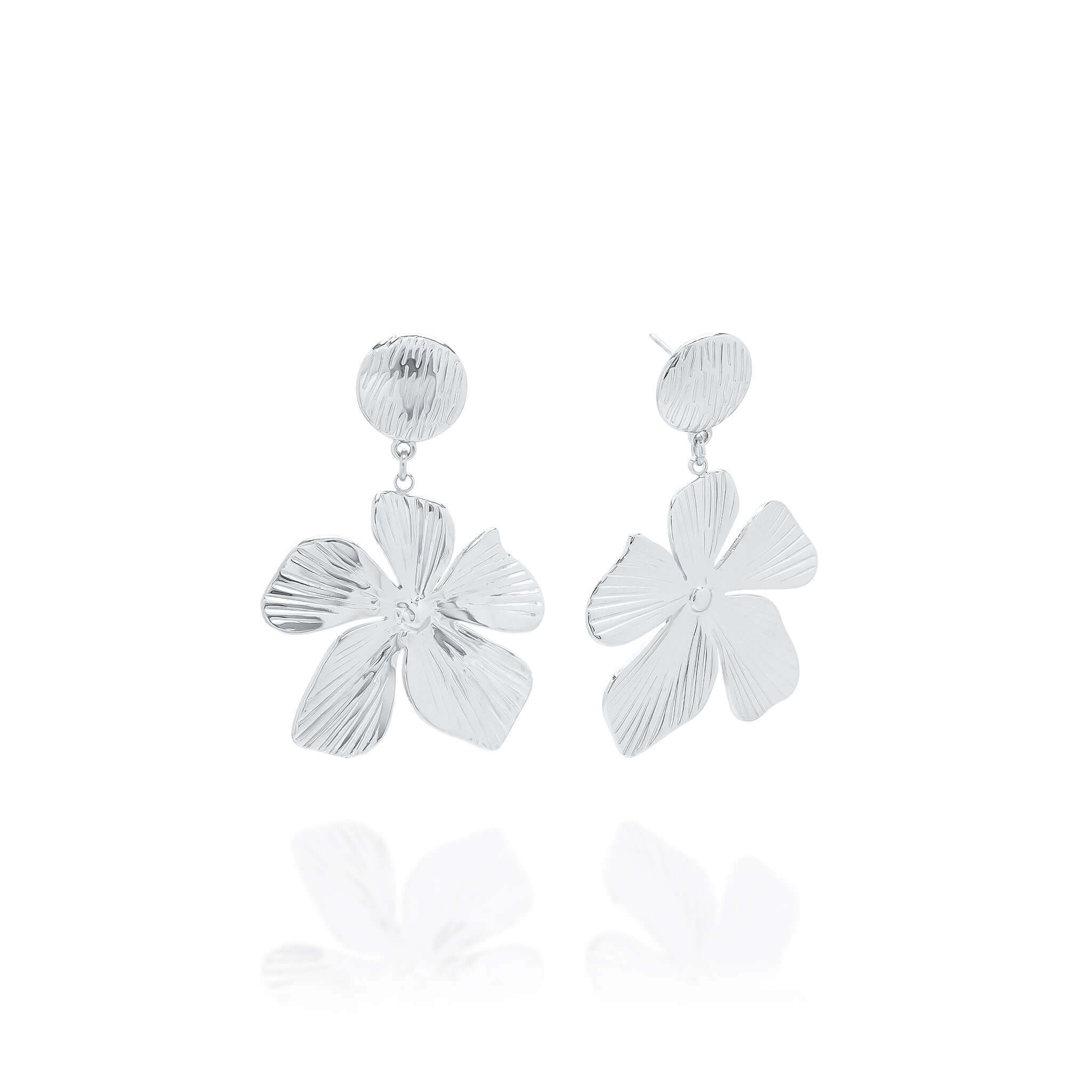 Malia Bloom Statement Earrings by ARIIRA, silver flower design with textured petals for elegant shimmer.