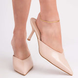 Woman wearing beige pointed heels with Layla Gold Herringbone Anklet for a stylish summer look.