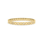 Ameera Lattice Engraved Gold Bangle Bracelet with crisscross design and subtle reflections for timeless elegance.