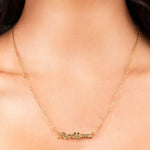 Elegant Alina Cursive Custom Name Necklace featuring 'ARIIRA' in gold cursive on a delicate chain.