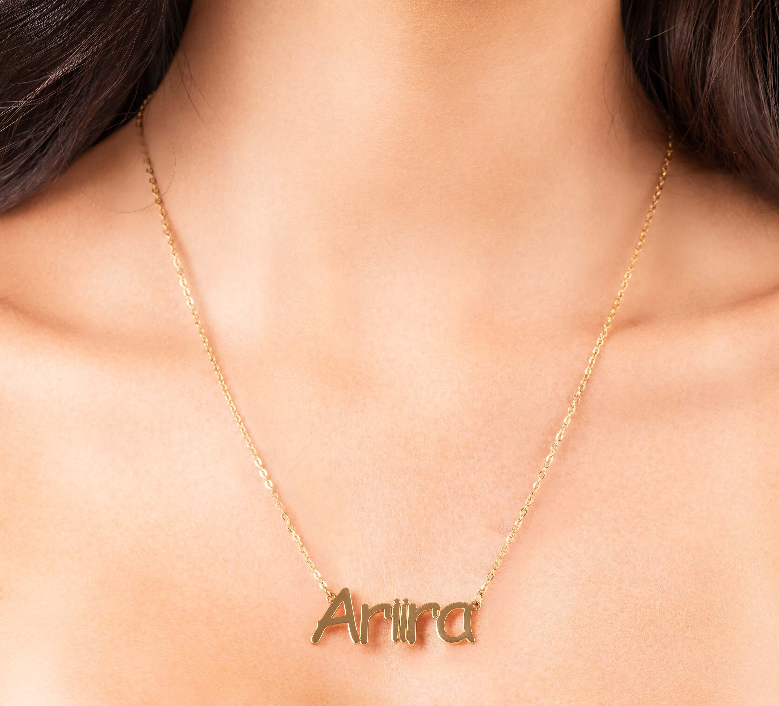 Personalized Sofia Custom Nameplate Necklace with 'Ariira' in gold script.