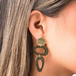 Iris Sculptural Drop Earrings by ARIIRA featuring dynamic shapes and a modern design, showcasing elegance and fluidity.