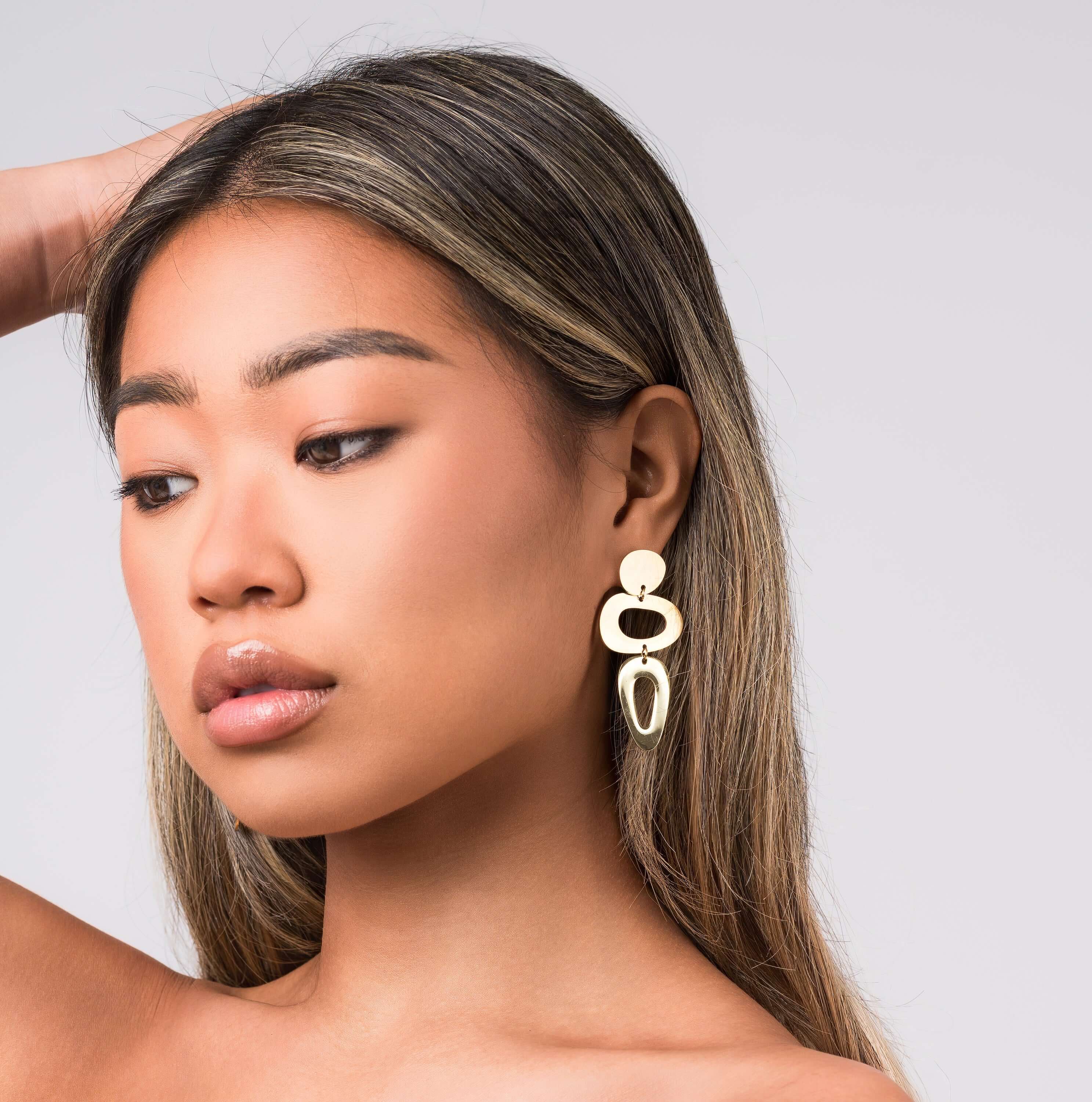 Iris Sculptural Drop Earrings by ARIIRA, featuring soft curves and bold design, perfect for self-expression and modern elegance.