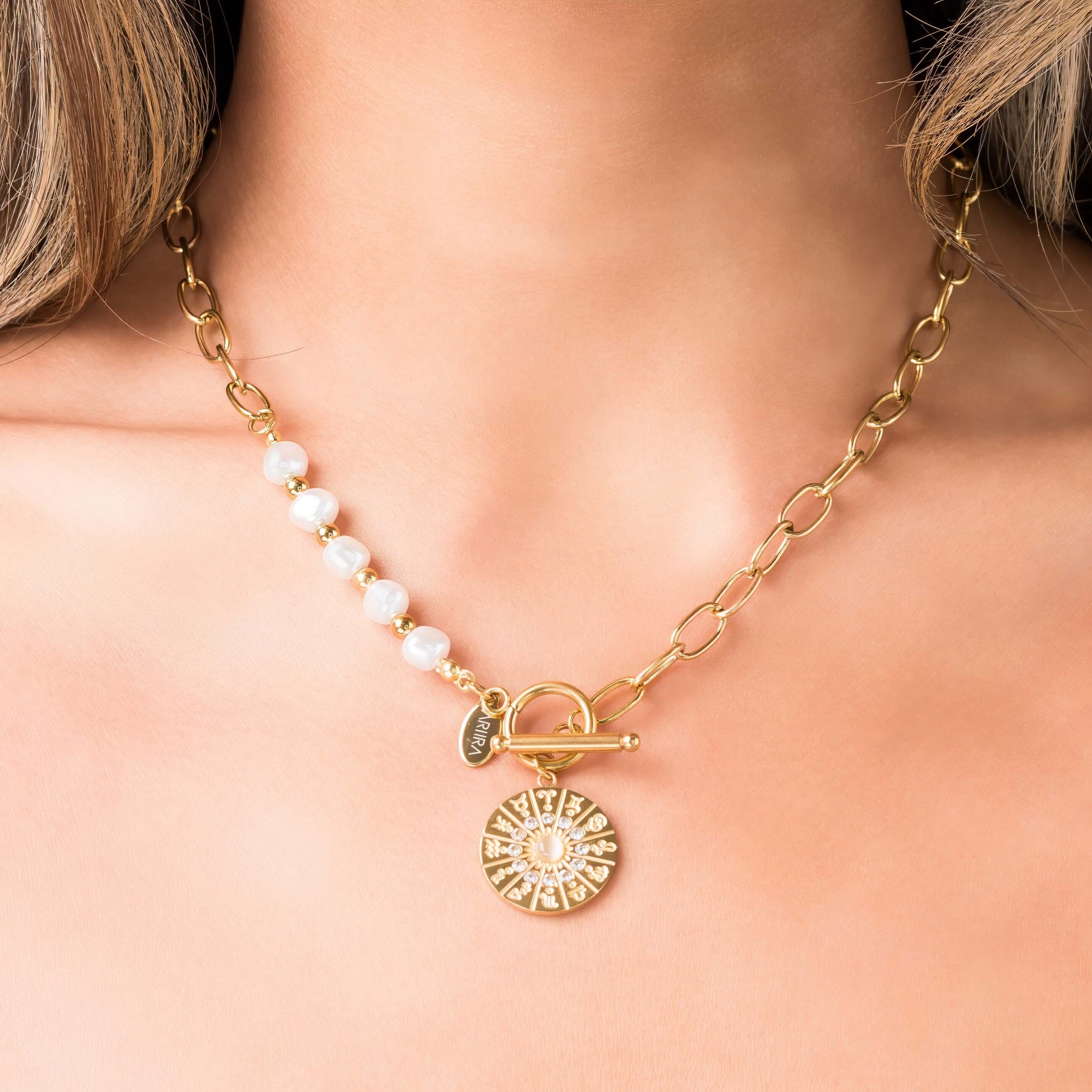 Mira Pearl Link Medallion Necklace by ARIIRA with freshwater pearls and gold chain links, featuring a detailed medallion charm.