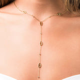 Mireya Y Drop chain necklace with oval motifs by ARIIRA, featuring delicate gold links and sparkling stones.