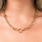 Elina Chunky Link Toggle Chain Necklace by ARIIRA, featuring bold gold links and a circular toggle clasp.