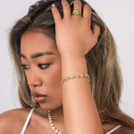 Model showcasing the ARIIRA Safa Crystal Flower Link Bracelet paired with elegant jewellery, highlighting femininity and sparkle.