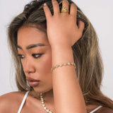 Model showcasing the ARIIRA Safa Crystal Flower Link Bracelet paired with elegant jewellery, highlighting femininity and sparkle.