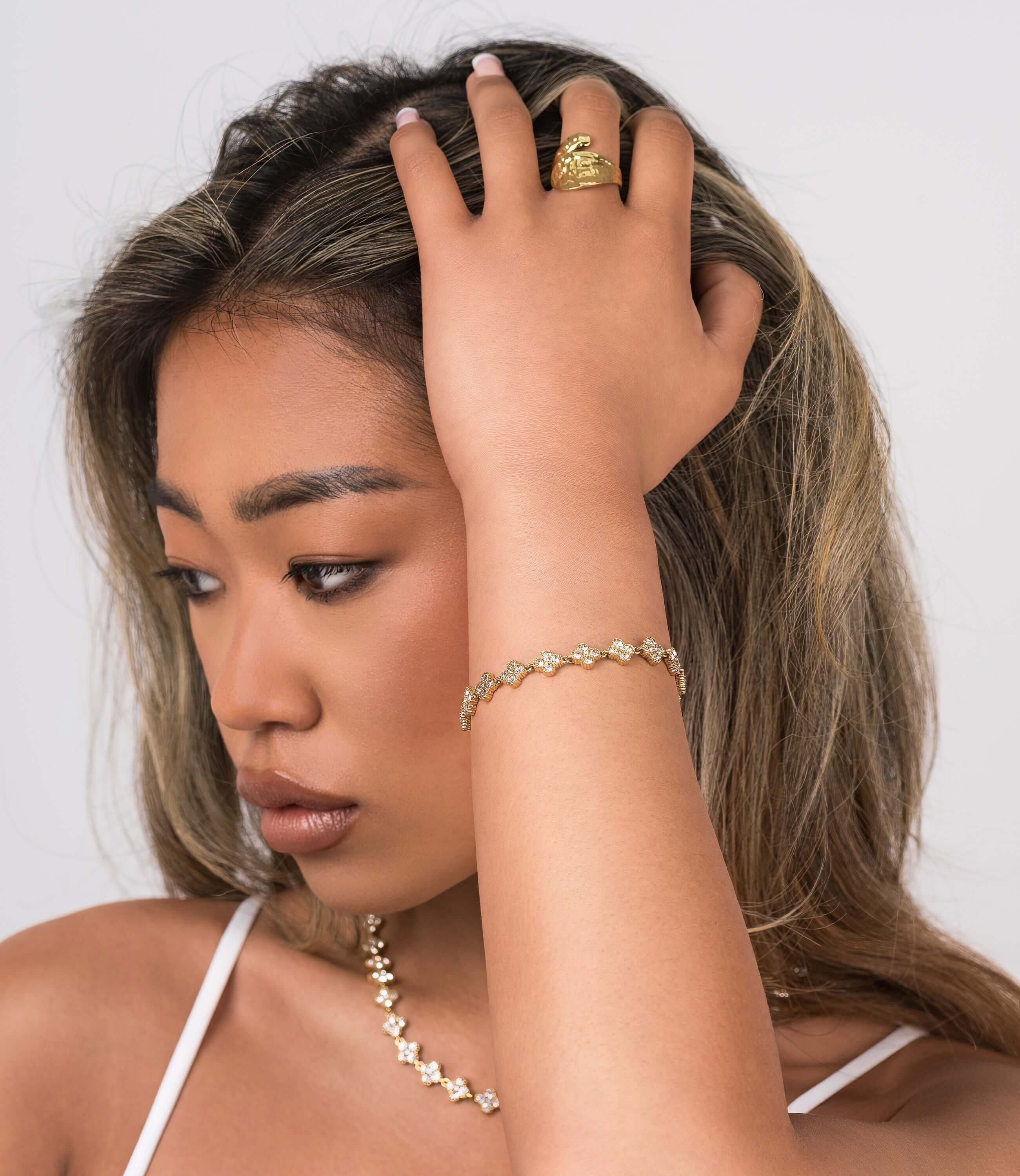 Model showcasing the ARIIRA Safa Crystal Flower Link Bracelet paired with elegant jewellery, highlighting femininity and sparkle.