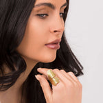 Elegant woman wearing ARIIRA's Aria winged textured adjustable ring, showcasing its delicate gold design.