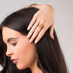 Woman wearing the ARIIRA Lyra Crystal Branch Adjustable Ring, showcasing its nature-inspired elegance.