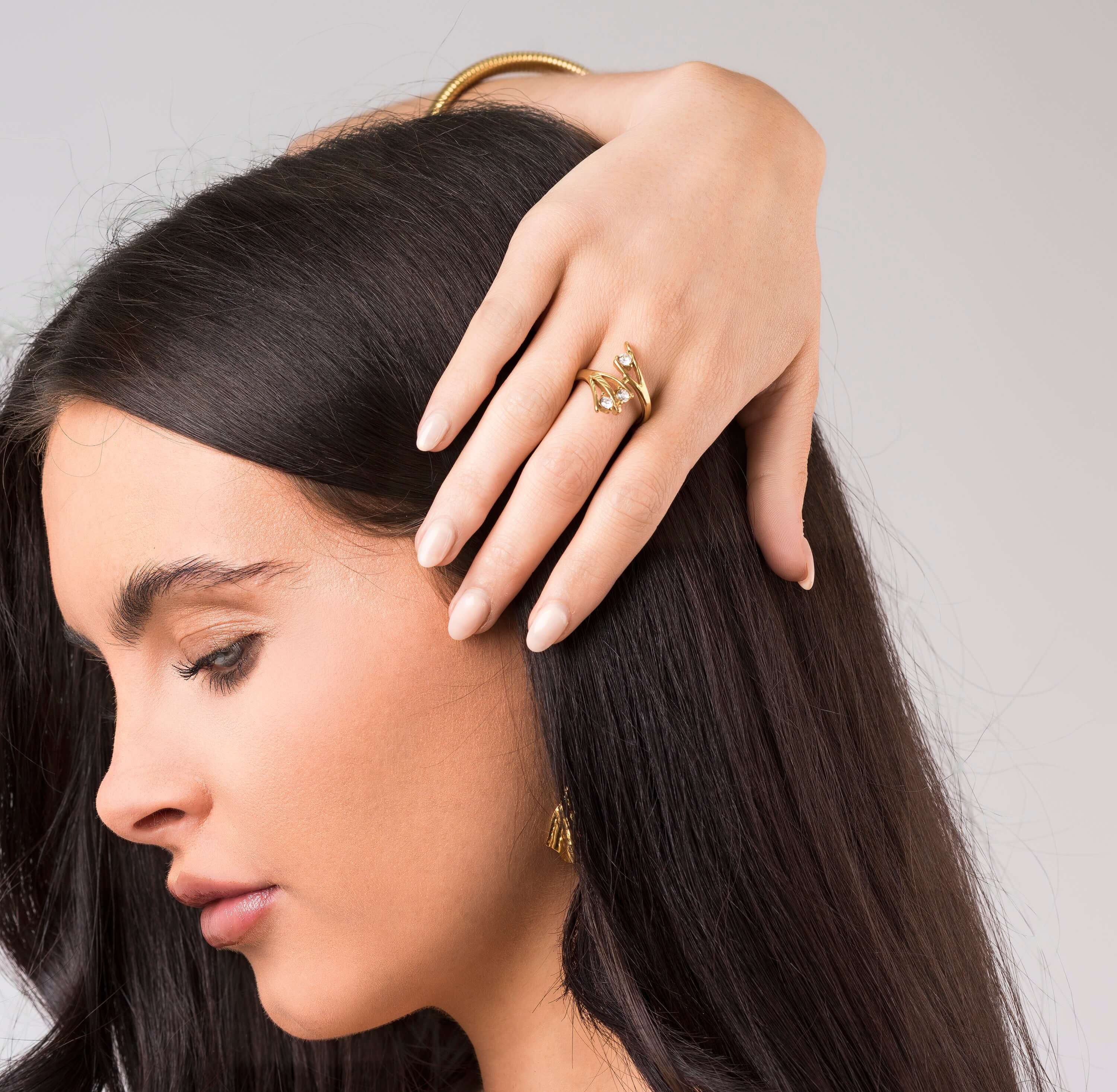 Woman wearing the ARIIRA Lyra Crystal Branch Adjustable Ring, showcasing its nature-inspired elegance.