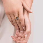 Kaia Triple Tone Crystal Ring Set featuring stackable rose, gold, and silver bands with crystals, showcasing elegance and versatility.