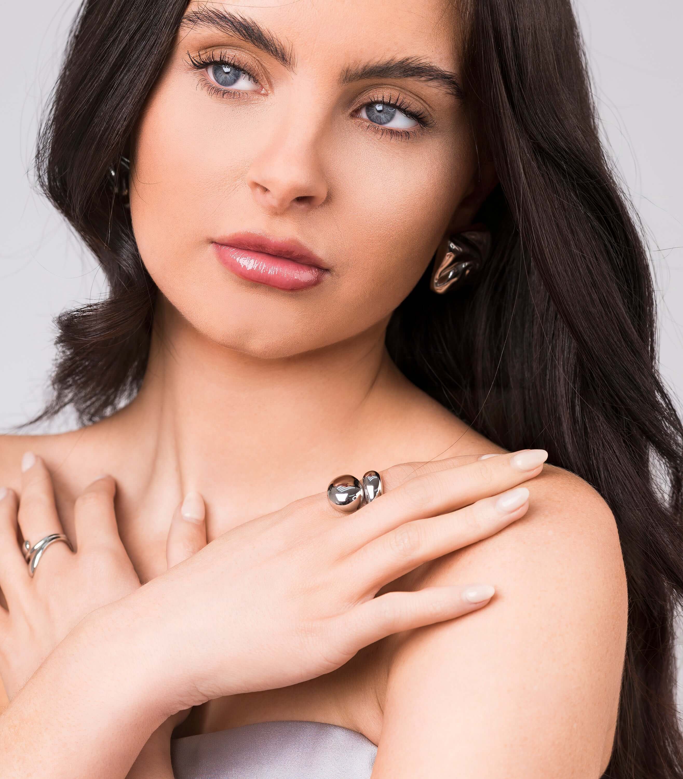 Model showcasing the Inaya Sculptural Open Dome Ring by ARIIRA with elegant styling and polished finish.