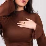 Woman wearing the Agnes Water Drop Adjustable Ring by ARIIRA, showcasing its elegant design on her hand.