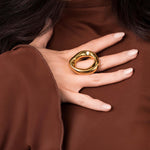 Sculptural Sylvie Open Form statement ring by ARIIRA, showcasing organic curves and a polished gold surface.