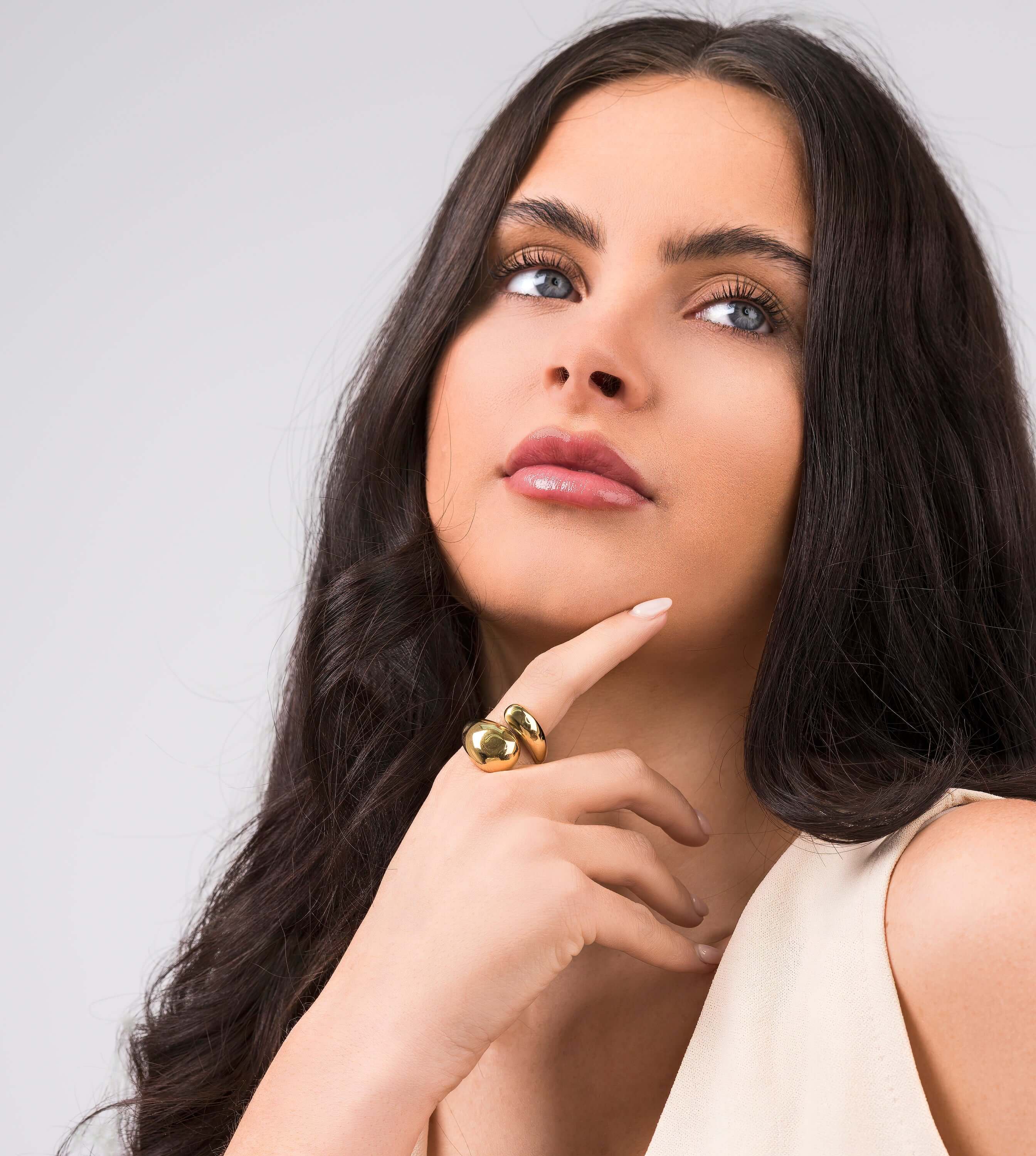 Model showcasing the Inaya Sculptural Open Dome Ring with soft curves and a polished mirror finish.
