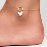 Close-up of Freya Delicate Pearl Charm Anklet with gold-plated chain and pearl-like beads on an ankle.
