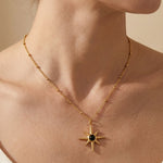 gold Gaia Gold Tone Starburst Pendant Necklace