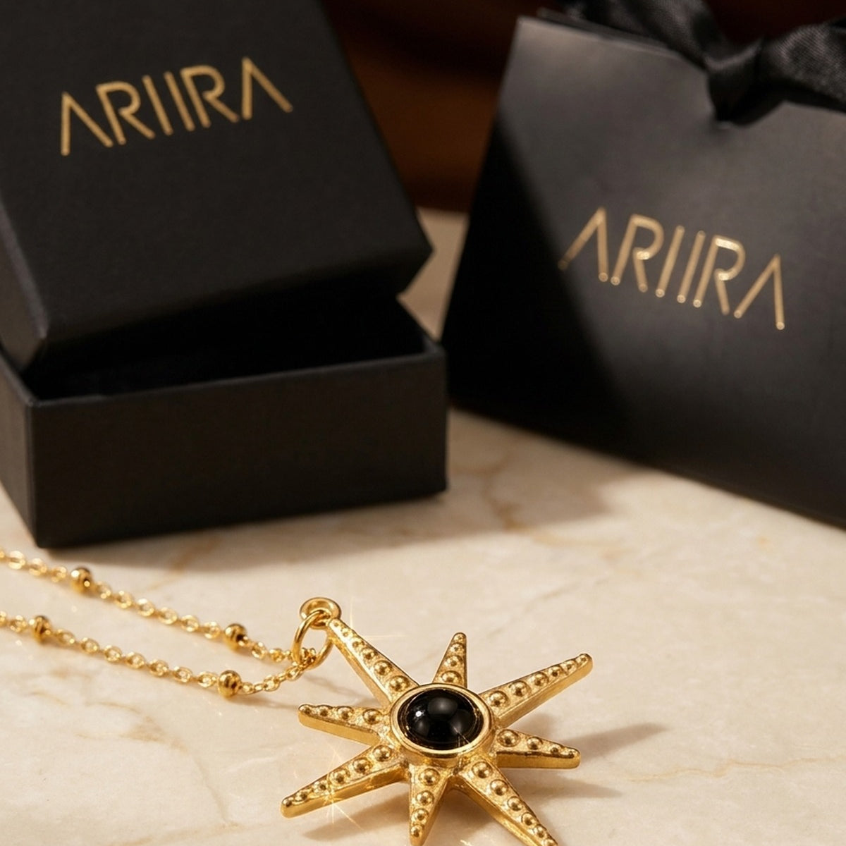 gold Gaia Gold Tone Starburst Pendant Necklace
