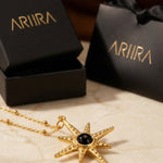 gold Gaia Gold Tone Starburst Pendant Necklace