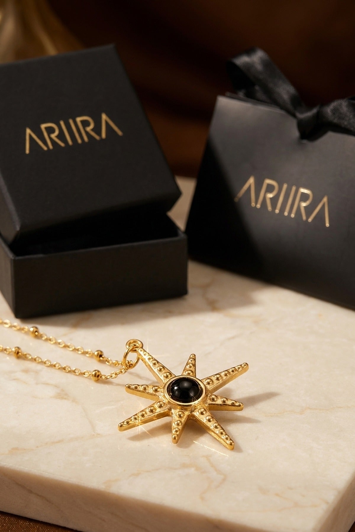 gold Gaia Gold Tone Starburst Pendant Necklace