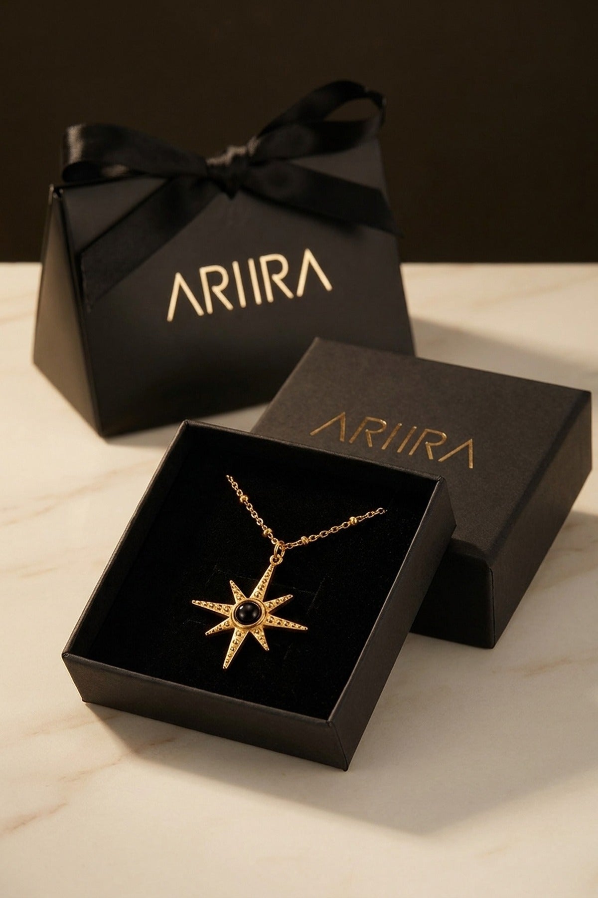 gold Gaia Gold Tone Starburst Pendant Necklace